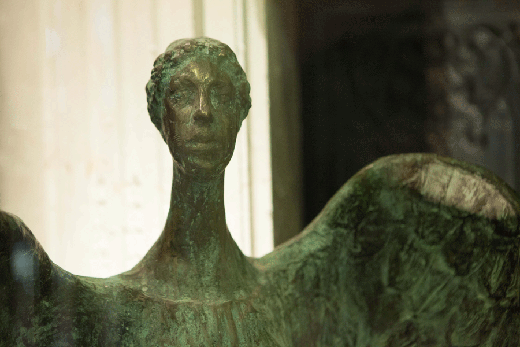 bronze sculpture of guardian angel
