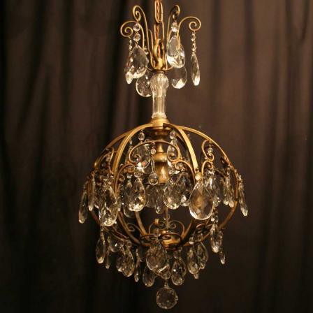 Elegant and remarkable antique ceiling light. The material is gilt bronze and top quality crystal drops. Western Europe, the early 20 C.