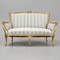 Antique gilded sofa in Louis XV style