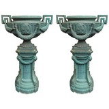A pair of unusual columns with flowerpots