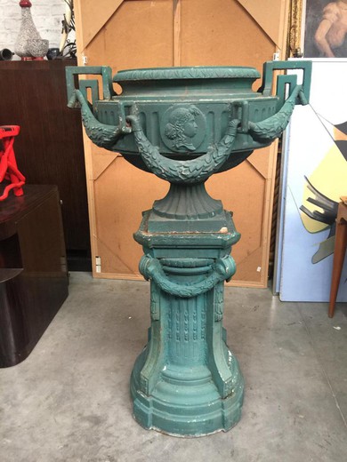 A pair of unusual columns with flowerpots