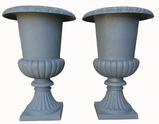 Paired cast iron flowerpots