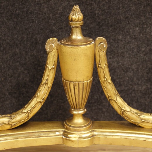 Furniture in nicely carved and gilded woodand plaster in Louis XVI style. Elegant neoclassical console table with original marble top in perfect condition.