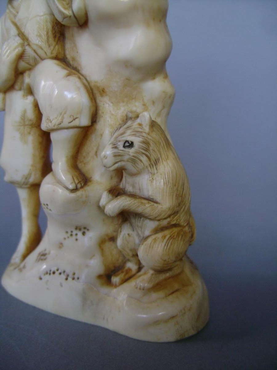 Okimono In Ivory. Group Of Men And Fox