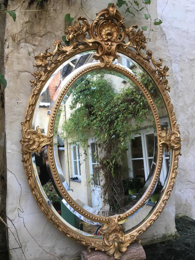 Medaillon Mirror Bevelled Wooden And Stucco Gilded 19thc