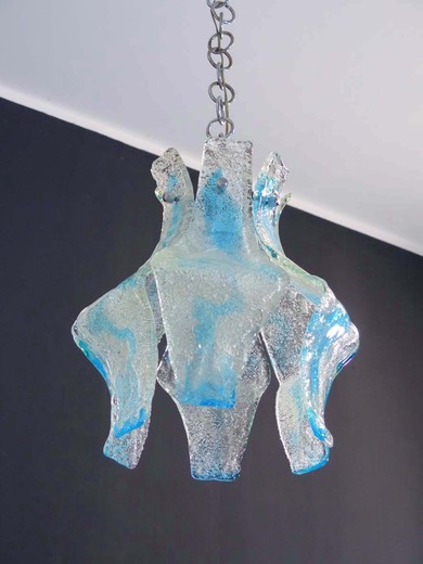 Flower suspension chandelier by Mazzega; petals Murano glass transparent and blue; chromed metal frame.