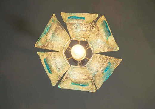Flower suspension chandelier by Mazzega; petals Murano glass transparent and blue; chromed metal frame.