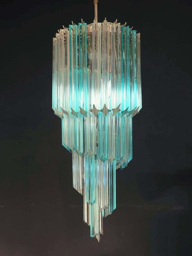 Fantastic and big Murano chandelier made by 54 Murano crystal prism (quadriedri) in a chrome metal frame. The shape of this chandelier is spiral. Glasses with two different colors, blue and trasparent.