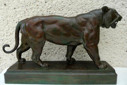 Antique sculpture of a walking tiger