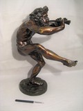 Antique sculpture of a dancing faun