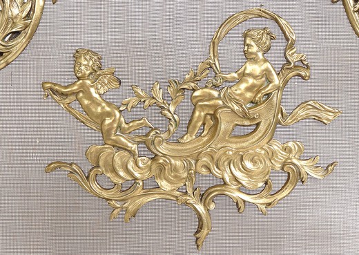 fireplace screen gilded bronze finely chiseled woman on a chariot drawn by cherub in the center, border shaped foliage and stylized shells