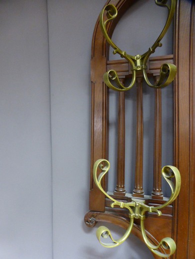 An antique coat rack in the Art Nouveau style. It is made of walnut. France, the 20th century.