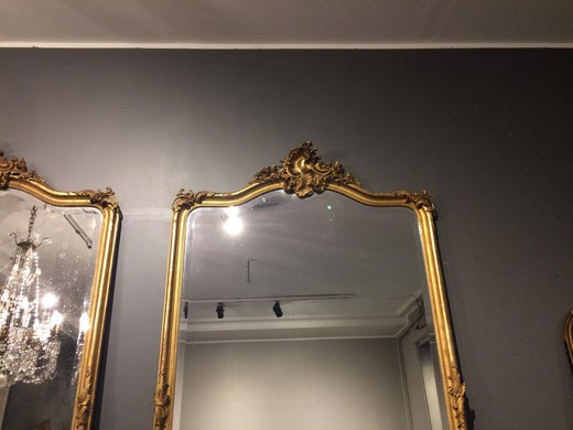 Antique pair mirrors in the style of Louis XV. The frames are made of gilded wood. France, XIX century.
