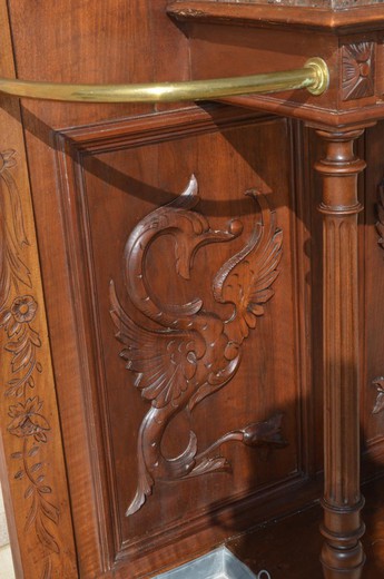 An antique coat rack in the Art Nouveau style. It is made of walnut. France, the 20th century.