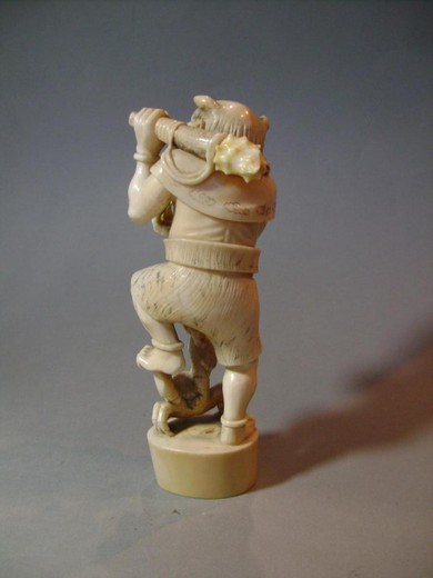 An antique okimono with the image "Oni". It is made of bone. France, 1900s.