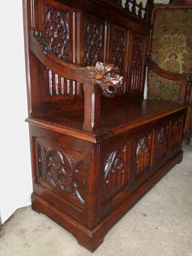 An old bench in the Gothic style. It is made of walnut. France, XIX century.
