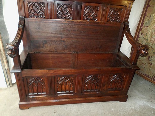 An old bench in the Gothic style. It is made of walnut. France, XIX century.
