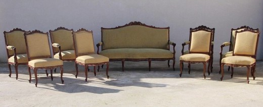 Antique set in the style of Louis XV. Seth includes a sofa, two wide armchairs and a pair of chairs. Made of walnut. France, XIX century.