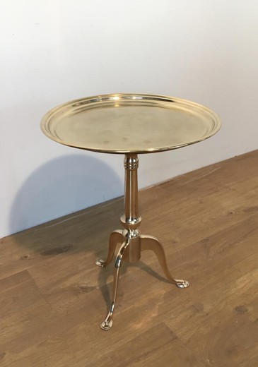 Antique table. It is made of brass. France, the 20th century.