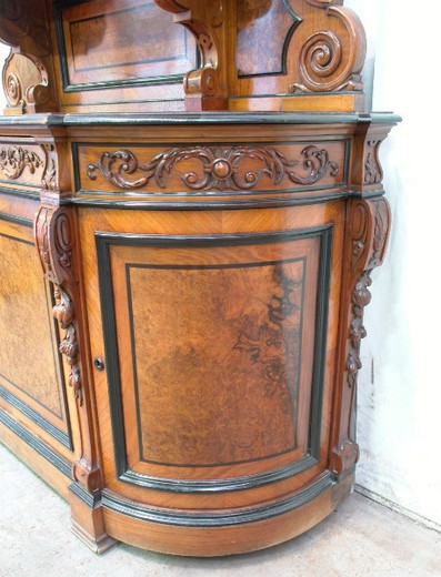 Antique cabinet in the style of Henry II. Made of walnut. Europe, the XIX century.