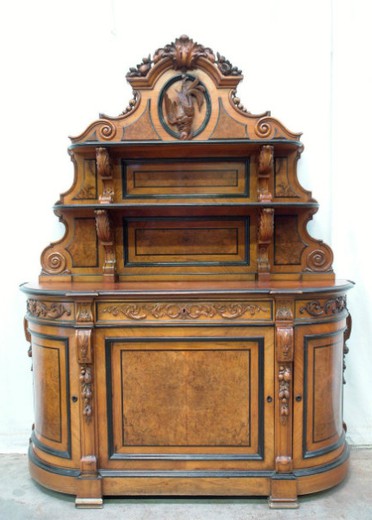 Antique cabinet in the style of Henry II. Made of walnut. Europe, the XIX century.