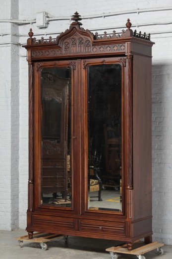 Antique wardrobe in the Gothic style. Made of walnut. France, 1900s.