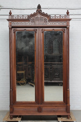 Antique wardrobe in the Gothic style. Made of walnut. France, 1900s.