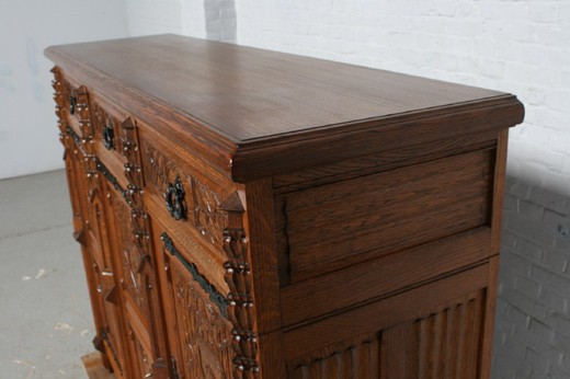 Antique cabinet in the Gothic style. Made of oak. Europe, the 1920s.