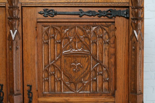 Antique cabinet in the Gothic style. Made of oak. Europe, the 1920s.