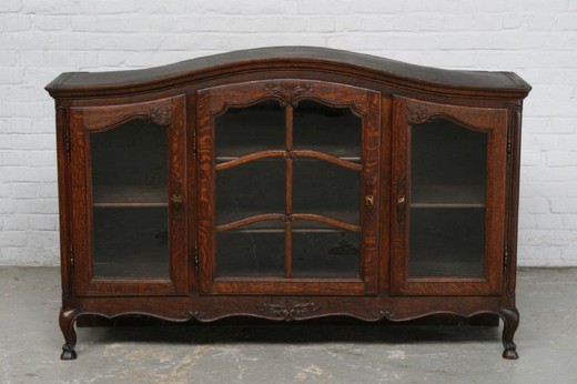 Antique showcase in the style of Louis XV. Made of oak. France, 1920's.