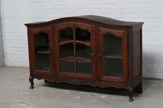 Antique showcase in the style of Louis XV. Made of oak. France, 1920's.