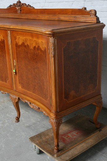 An antiquarian dresser in the style of Louis XV. Made of walnut. France, the 20th century.