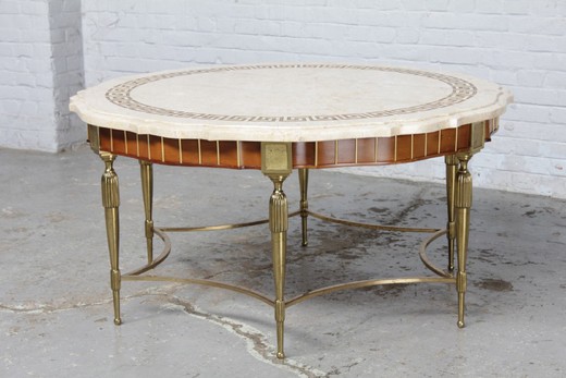 Antique coffee table in the style of Louis XVI. It is made of brass and walnut. The table top is marble. France, 1930's.