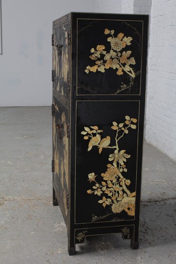Antique cabinet in oriental style. It is made of wood. France, 1920's.