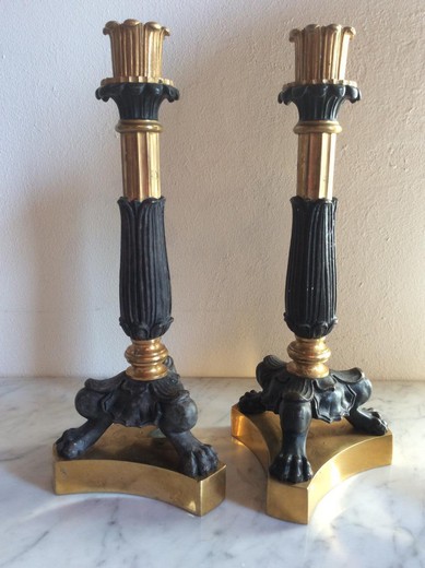 Antique paired candlesticks