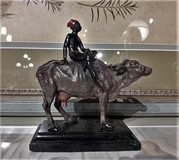 Antique sculpture "Boy on the Buffalo"