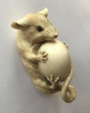 japanese okimono of a mouse with an egg