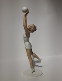 Antique sculpture of a volley ball player