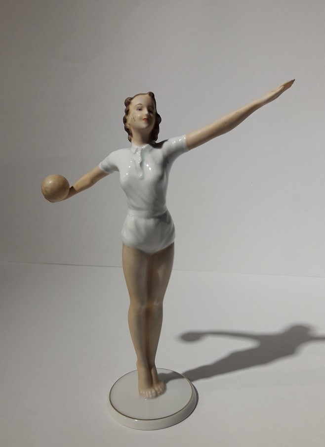 Antique sculpture of a volley ball player