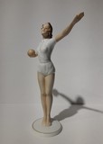 Antique sculpture of a volley ball player