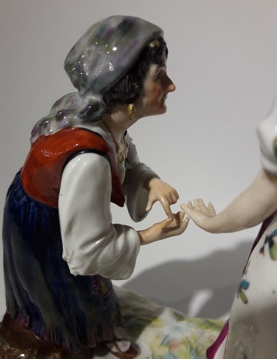 Antique sculpture of a lady and a fortune teller