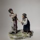 Antique sculpture of a lady and a fortune teller