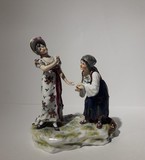 Antique sculpture of a lady and a fortune teller