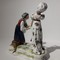 Antique sculpture of a lady and a fortune teller