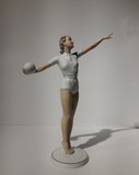 Antique sculpture of a volley ball player