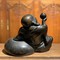 The sculpture "Hotei with peach"
