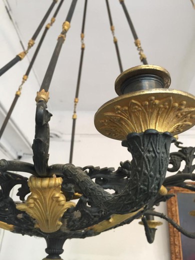 Antique Candle Chandelier in the style of Napoleon III. It is made of bronze with gilding. France, XIX century.