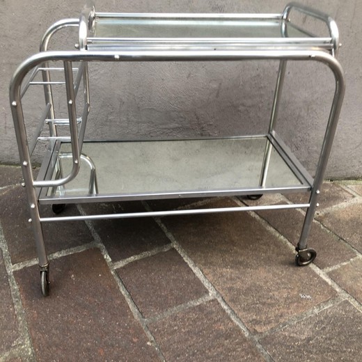 Antique serving table in the Art Deco style. It is made of chrome-plated aluminum. France, the 20th century.