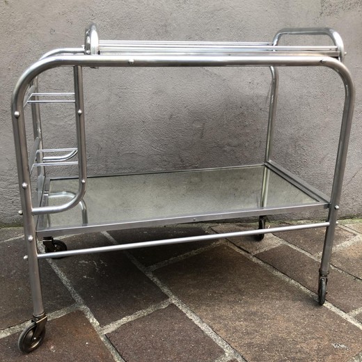 Antique serving table in the Art Deco style. It is made of chrome-plated aluminum. France, the 20th century.