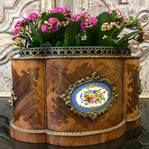 Antique pots in the style of Louis XV. It is made of mahogany. Decorated with patches of gilded bronze. France, XIX century.